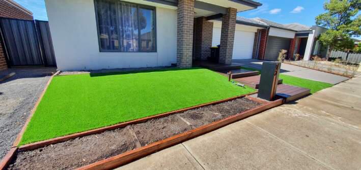 Kastle Kool 40 installed beside stone, brick and timber landscaping