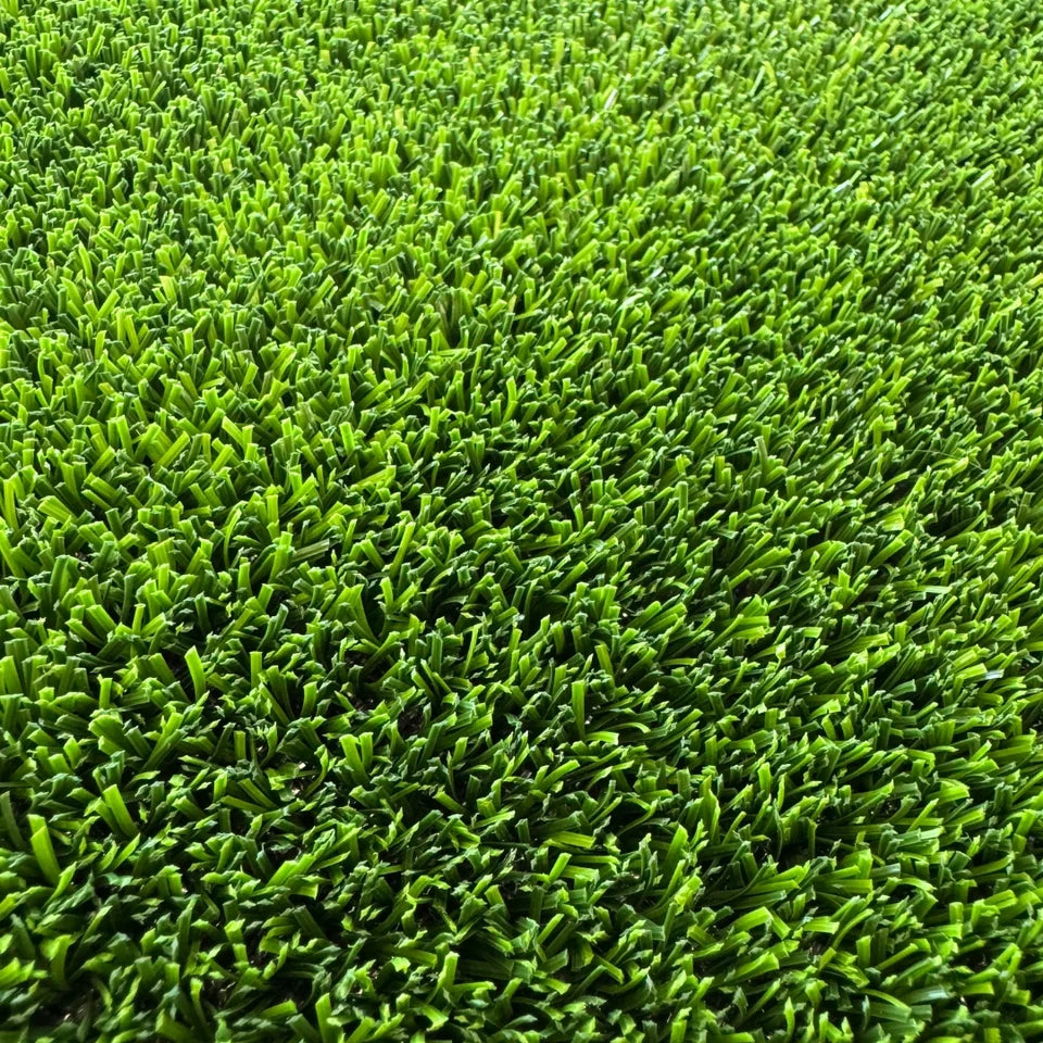 Close-up of the short, dense Ausgrass Cricket Pro playing surface