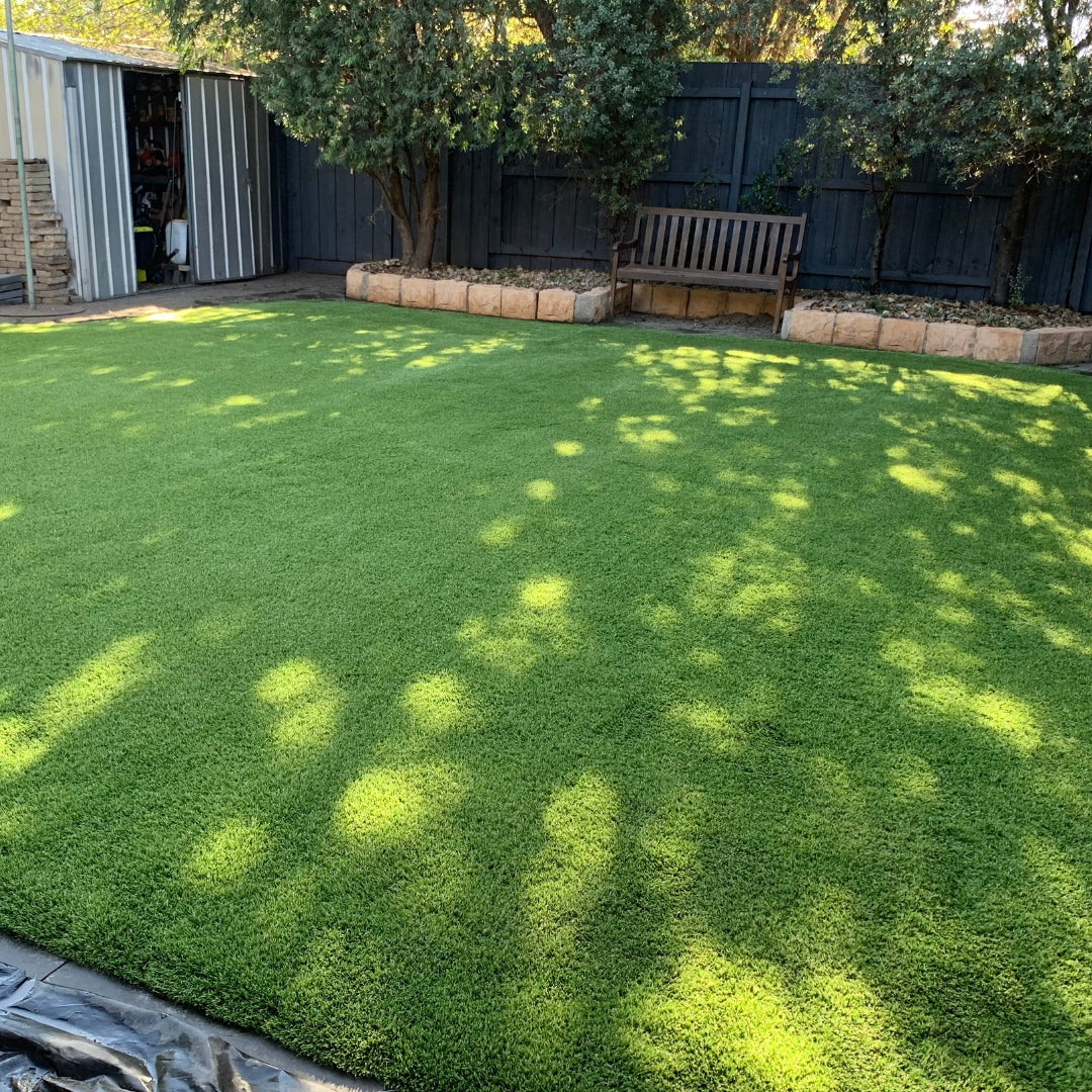 emerald green synthetic grass install